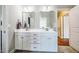 Bathroom with double vanity, mirrors, storage and neutral color palette at 658 Bennett Mountain Trce, Chapel Hill, NC 27516
