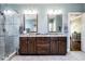 Bathroom with a double sink vanity with storage, walk-in shower, and marble flooring at 658 Bennett Mountain Trce, Chapel Hill, NC 27516