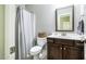 Bathroom with vanity, toilet, and shower featuring neutral tones and a large mirror at 658 Bennett Mountain Trce, Chapel Hill, NC 27516