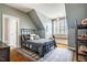 Comfortable bedroom with unique decor, plush rug, and an abundance of natural light at 658 Bennett Mountain Trce, Chapel Hill, NC 27516