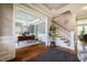 Elegant entryway boasts hardwood floors, staircase, and access to a bright, inviting home office at 658 Bennett Mountain Trce, Chapel Hill, NC 27516