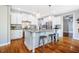 Bright kitchen featuring white cabinetry, a kitchen island, and stainless steel appliances at 658 Bennett Mountain Trce, Chapel Hill, NC 27516
