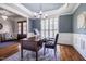 Stylish office space featuring a chandelier, plantation shutters, and beautiful hardwood floors at 658 Bennett Mountain Trce, Chapel Hill, NC 27516