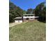 Charming two-story home with a brick exterior and a two-car garage, surrounded by mature trees at 683 Osgood Rd, Sanford, NC 27330