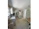 Eat-in kitchen with an island, older appliances, and light-colored cabinetry at 683 Osgood Rd, Sanford, NC 27330