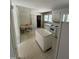 Kitchen featuring an island, breakfast nook, older appliances, and access to other rooms at 683 Osgood Rd, Sanford, NC 27330