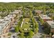 Aerial view of a vibrant community with a gathering area, businesses and apartments at 703 Copperline Dr # 301, Chapel Hill, NC 27516