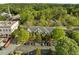 Aerial view of a community building with ample parking and lush greenery surrounding the property at 703 Copperline Dr # 301, Chapel Hill, NC 27516