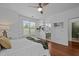 Bright bedroom featuring hardwood floors, built in shelves and ensuite bathroom access at 703 Copperline Dr # 301, Chapel Hill, NC 27516