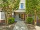 Home entrance with red brick and trees framing the entrance at 703 Copperline Dr # 301, Chapel Hill, NC 27516