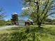 Home exterior with a beautiful yard and a convenient two-car garage at 706 Orchard Dr, Graham, NC 27253