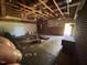 Garage with exposed ceiling beams and a garage door at 706 Orchard Dr, Graham, NC 27253