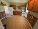 Functional kitchen with wood cabinetry and a white appliance package at 706 Orchard Dr, Graham, NC 27253