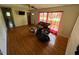 Spacious living room with hardwood floors and large windows for natural light at 706 Orchard Dr, Graham, NC 27253