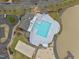 Aerial view of community pool, volleyball court, and a sandy playground at 707 Southshore Pkwy, Durham, NC 27703