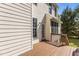 Wooden deck of a home with an exterior door leading to a backyard with green trees at 707 Southshore Pkwy, Durham, NC 27703