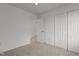 Bright bedroom featuring an open closet area and a large window at 707 Southshore Pkwy, Durham, NC 27703