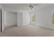 Bright bedroom features a double door closet and a large window with verdant views at 707 Southshore Pkwy, Durham, NC 27703