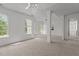 Bonus room featuring great natural light, plush carpet and supporting columns at 707 Southshore Pkwy, Durham, NC 27703