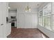 Cozy breakfast nook area with tile flooring and bright windows at 707 Southshore Pkwy, Durham, NC 27703