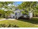 Inviting two-story home boasts a well-kept lawn, a two-car garage, and a charming front entrance enhanced by lush landscaping at 707 Southshore Pkwy, Durham, NC 27703