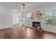 Spacious living room featuring a brick fireplace and lots of natural light at 707 Southshore Pkwy, Durham, NC 27703