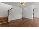 Spacious living room with hardwood floors and natural light filled with ceiling fan at 707 Southshore Pkwy, Durham, NC 27703