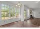 Light-filled sunroom with large windows and access to the backyard and fireplace at 707 Southshore Pkwy, Durham, NC 27703