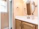 Bright bathroom with a round mirror, stylish vanity, and a well-lit, clean design at 713 Macon Pl, Raleigh, NC 27609