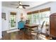 Bright breakfast nook with hardwood floors, large windows, and a door to the outside at 713 Macon Pl, Raleigh, NC 27609