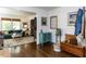 Open-concept entryway with hardwood floors flowing into the bright living room space at 713 Macon Pl, Raleigh, NC 27609
