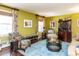 Bright living room featuring hardwood floors, stylish furniture, and natural light at 713 Macon Pl, Raleigh, NC 27609