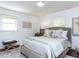 Serene main bedroom with neutral tones, soft bedding, and plenty of natural light at 713 Macon Pl, Raleigh, NC 27609