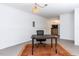Finished basement office space with industrial lighting, brick accent wall, and kitchenette at 713 Macon Pl, Raleigh, NC 27609