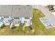 Aerial view of backyard patios, driveway parking, and new landscaping at 72 S Grey Abbey Dr, Clayton, NC 27527