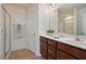 Bathroom features double vanity, wood cabinets, and glass-enclosed shower at 72 S Grey Abbey Dr, Clayton, NC 27527