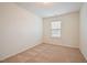 Bedroom with window, neutral carpet, and neutral walls at 72 S Grey Abbey Dr, Clayton, NC 27527