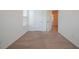 Carpeted bedroom showcasing a closet and doorway leading to a bathroom at 72 S Grey Abbey Dr, Clayton, NC 27527
