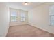Bright bedroom with large windows allowing natural light and neutral carpet at 72 S Grey Abbey Dr, Clayton, NC 27527