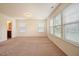 Large, bright room with lots of natural light from multiple windows at 72 S Grey Abbey Dr, Clayton, NC 27527