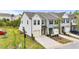 Beautiful townhouse showcasing a driveway, single-car garage, and manicured lawn with small shrubs at 72 S Grey Abbey Dr, Clayton, NC 27527