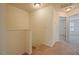Carpeted upstairs hallway featuring a view into a bedroom at 72 S Grey Abbey Dr, Clayton, NC 27527