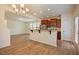 Open-concept kitchen with stainless steel appliances, breakfast bar, and adjoining living area with lots of space at 72 S Grey Abbey Dr, Clayton, NC 27527