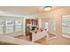 An airy, modern kitchen with stainless steel appliances, dark wood cabinetry, and bar seating at 72 S Grey Abbey Dr, Clayton, NC 27527