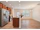 Modern kitchen featuring stainless steel appliances, granite countertops, and wood-look flooring at 72 S Grey Abbey Dr, Clayton, NC 27527
