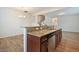 This spacious kitchen has a breakfast bar, stainless steel appliances, and beautiful granite countertops at 72 S Grey Abbey Dr, Clayton, NC 27527