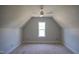 Attic bedroom with vaulted ceiling and a ceiling fan at 7301 Wexford Woods Ln, Wake Forest, NC 27587