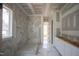 Modern bathroom with marble tile shower and flooring, offering a luxurious spa-like experience at 7301 Wexford Woods Ln, Wake Forest, NC 27587