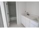 Bathroom featuring modern vanity with double sinks and tiled shower/tub at 7301 Wexford Woods Ln, Wake Forest, NC 27587