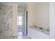 Elegant bathroom featuring double sinks and a marble-tiled shower at 7301 Wexford Woods Ln, Wake Forest, NC 27587